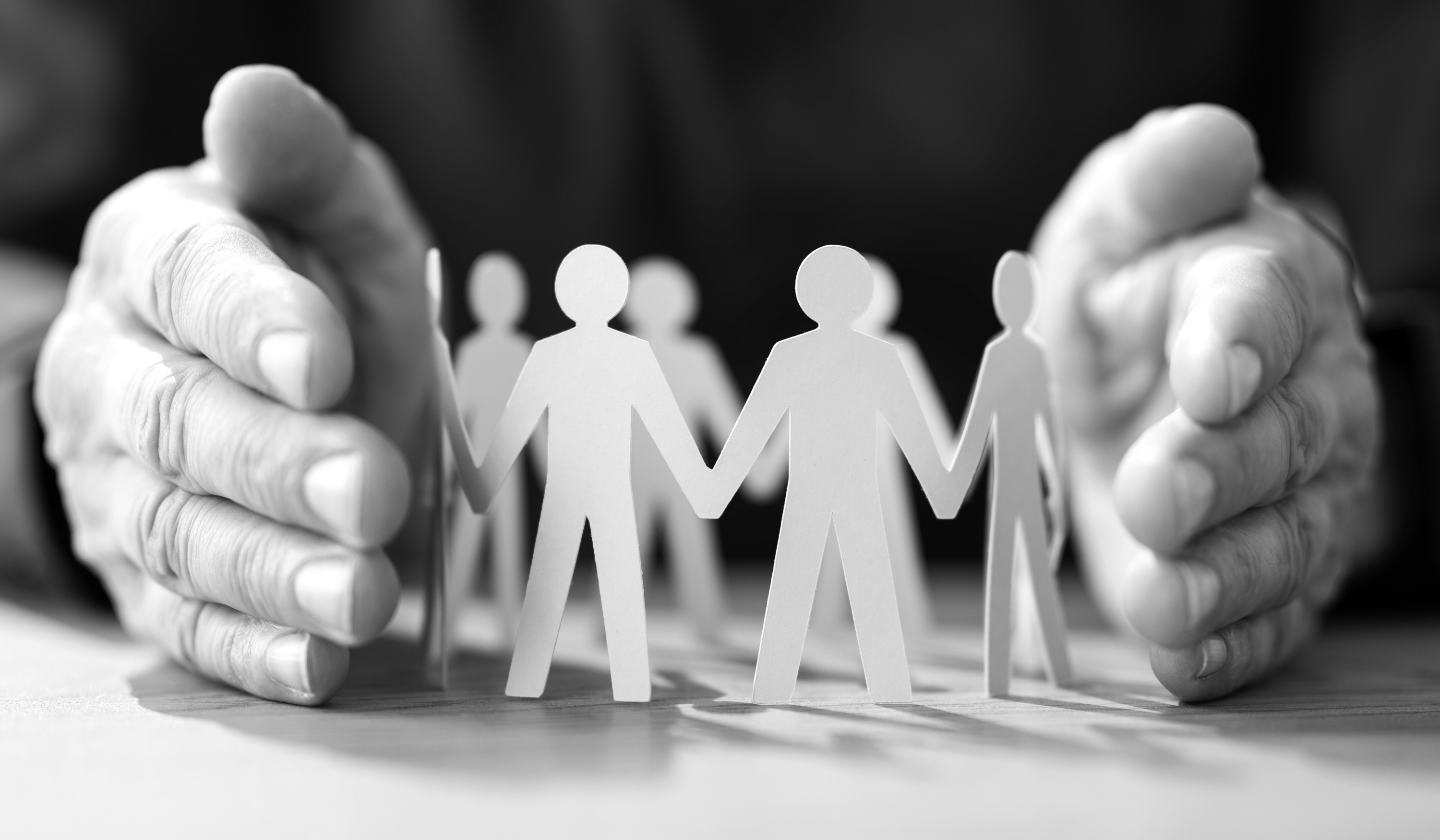 Employees sharing branded content on LinkedIn, highlighting how employee advocacy expands reach, trust, and brand visibility.